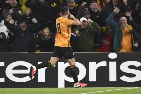 Wolverhampton Wanderers' Ruben Neves celebrates after scoring his side's second goal during the Europa League round of 32 match between Wolverhampton Wanderers and Espanyol at the Molineux Stadium, in Wolverhampton, England, Thursday Feb. 20, 2020. (AP Photo/ Rui Vieira)