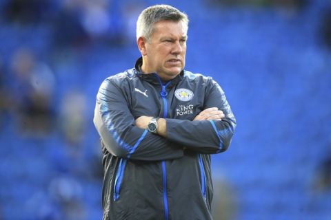 Leicester City manager Craig Shakespeare awaits the start of the Premier League soccer match. Leicester City versus Liverpool at the King Power Stadium, Leicester, England,  Saturday Sept. 23, 2017. (Mike Egerton/PA via AP)