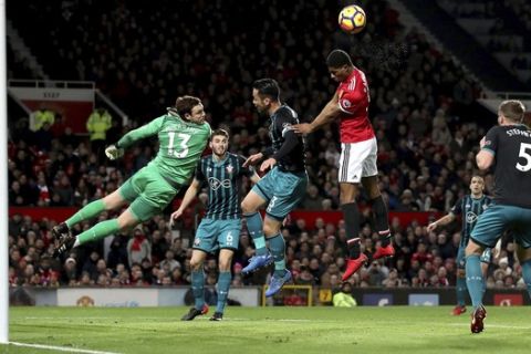 Manchester United's Marcus Rashford, center, misses a chance to score against Southampton during the English Premier League soccer match at Old Trafford, Manchester, England, Saturday Dec. 30, 2017. (Martin Rickett/PA via AP)