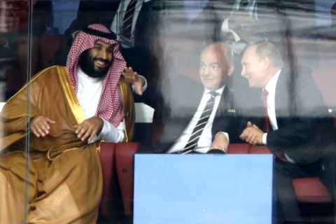 Saudi Arabia Crown Prince Mohammed bin Salman, left, FIFA President Gianni Infantino, center, and Russian President Vladimir Putin watch the match between Russia and Saudi Arabia which opens the 2018 soccer World Cup at the Luzhniki stadium in Moscow, Russia, Thursday, June 14, 2018. (AP Photo/Hassan Ammar)