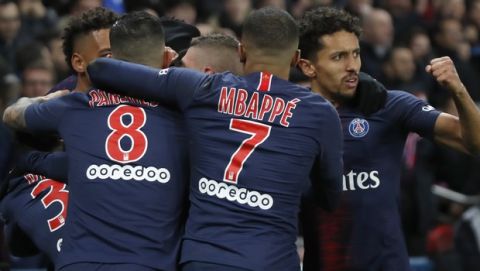 PSG players celebrate scoring their side's second goal during their French League One soccer match between Paris-Saint-Germain and Olympique Marseille at the Parc des Princes stadium in Paris, Sunday, March 17, 2019. (AP Photo/Christophe Ena)