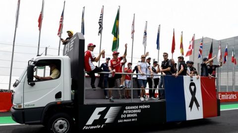SAO PAULO, BRAZIL - NOVEMBER 15:  Lewis Hamilton of Great Britain and Mercedes GP and the other drivers are seen during drivers' parade with the french flag to honor the victims of the terrorist attacks in Paris prior to the Formula One Grand Prix of Brazil at Autodromo Jose Carlos Pace on November 15, 2015 in Sao Paulo, Brazil.  (Photo by Lars Baron/Getty Images)