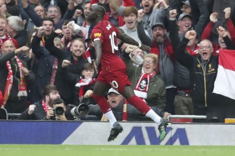 Liverpool's Sadio Mane celebrates his opening goal during English Premier League soccer match between Liverpool and Leicester City in Anfield stadium in Liverpool, England, Saturday, Oct. 5, 2019. (AP Photo/Jon Super)