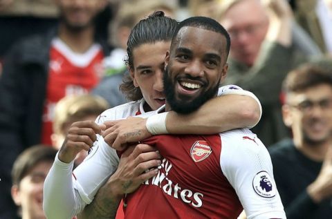 Arsenal's Alexandre Lacazette celebrates scoring his side's second goal of the game, during the English Premier League soccer match between Arsenal and Bournemouth, at the Emirates Stadium, in London, Saturday Sept. 9, 2017. (John Walton/PA via AP)