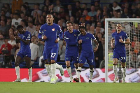 Chelsea's Raheem Sterling, second right, celebrates after scoring the opening goal during the English Premier League soccer match between Chelsea and Luton Town at Stamford Bridge stadium in London, Saturday, Aug. 26, 2023. (AP Photo/Ian Walton)