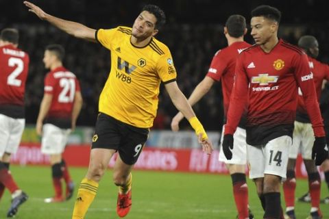 Wolverhampton's Raul Jimenez celebrates after scoring his side's opening goal during the English FA Cup Quarter Final soccer match between Wolverhampton Wanderers and Manchester United at the Molineux Stadium in Wolverhampton, England, Saturday, March 16, 2019. (AP Photo/Rui Vieira)