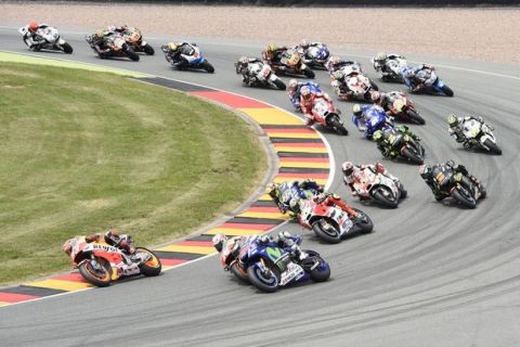 The riders have started in the MotoGP race at the Sachsenring circuit in Hohenstein-Ernstthal, Germany, Sunday, July 12, 2015. (AP Photo/Jens Meyer)