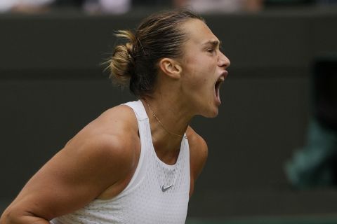 Aryna Sabalenka of Belarus celebrates a point against Madison Keys of the US during the women's singles match on day ten of the Wimbledon tennis championships in London, Wednesday, July 12, 2023. (AP Photo/Alastair Grant)