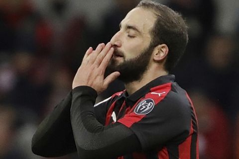 AC Milan's Gonzalo Higuain gestures after missing a scoring chance during a Serie A soccer match between AC Milan and Torino , at the San Siro stadium in Milan, Italy, Sunday, Dec. 9, 2018. (AP Photo/Luca Bruno)