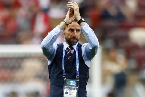 England head coach Gareth Southgate claps hands on the pitch prior the semifinal match between Croatia and England at the 2018 soccer World Cup in the Luzhniki Stadium in Moscow, Russia, Wednesday, July 11, 2018. (AP Photo/Matthias Schrader)