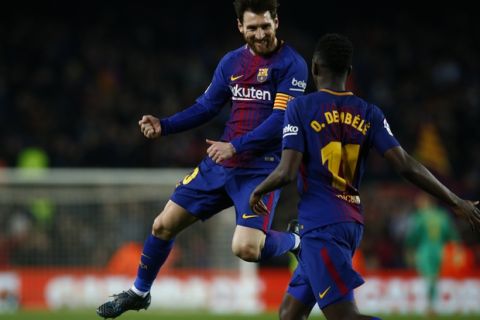 FC Barcelona's Lionel Messi celebrates after scoring with his teammate Dembele during the Spanish La Liga soccer match between FC Barcelona and Girona at the Camp Nou stadium in Barcelona, Spain, Saturday, Feb. 24, 2018. (AP Photo/Manu Fernandez)