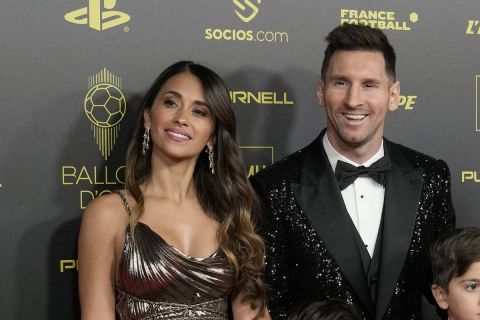 PSG player Lionel Messi, his wife Antonela Roccuzzo and their sons Thiago, Matteo and Ciro arrive for the 65th Ballon d'Or ceremony at Theatre du Chatelet, in Paris, Monday, Nov. 29, 2021. (AP Photo/Christophe Ena)