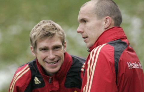 Per Mertesacker, left, and Robert Enke, right, talk during their training session in Barsinghausen near Hanover, Germany, Wednesday, Nov. 14, 2007. Germany will face Cyprus during a group D qualifying match for the Soccer Euro 2008 on Saturday Nov. 17, 2007. (AP Photo/Kai-Uwe Knoth)