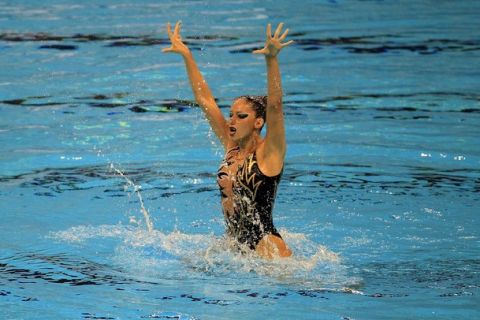 SHANGHAI, CHINA - JULY 17: Despoina Solomou of Greece competes in the Synchronized Swimming Solo Tech preliminary round during Day Two of the 14th FINA World Championships at the Oriental Sports Center on July 17, 2011 in Shanghai, China.  (Photo by Ezra Shaw/Getty Images)