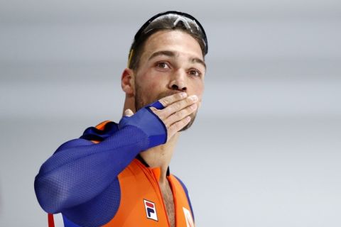 Gold medallist Kjeld Nuis of The Netherlands throws a kiss hand after the men's 1,500 meters speedskating race at the Gangneung Oval at the 2018 Winter Olympics in Gangneung, South Korea, Tuesday, Feb. 13, 2018. (AP Photo/Vadim Ghirda)