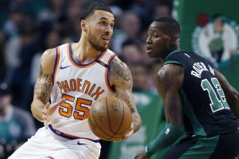 Phoenix Suns' Mike James (55) pivots beside Boston Celtics' Terry Rozier (12) during the fourth quarter of an NBA basketball game in Boston, Saturday, Dec. 2, 2017. The Celtics won 116-111. (AP Photo/Michael Dwyer)