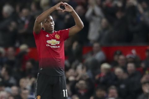 Manchester United's Anthony Martial celebrates after scoring his side 2nd goal of the game during their English Premier League soccer match between Manchester United and Newcastle United at Old Trafford in Manchester, England, Saturday, Oct. 6, 2018. (AP Photo/Jon Super)