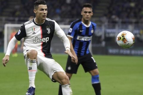 Juventus' Cristiano Ronaldo controls the ball during a Serie A soccer match between Inter Milan and Juventus, at the San Siro stadium in Milan, Italy, Sunday, Oct. 6, 2019. (AP Photo/Luca Bruno)