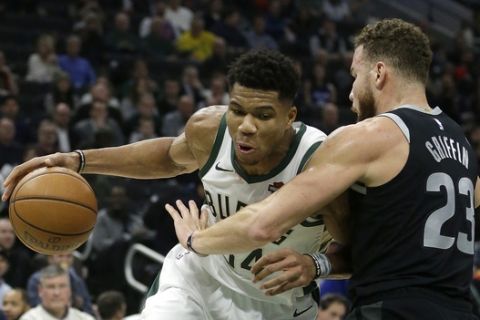 Milwaukee Bucks' Giannis Antetokounmpo, left, drives against Detroit Pistons' Blake Griffin during the second half of an NBA basketball game Wednesday, Dec. 5, 2018, in Milwaukee. (AP Photo/Aaron Gash)