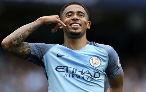 Manchester City's Gabriel Jesus celebrates scoring his side's second goal of the game, during the English Premier League soccer match between Manchester City and Leicester, at the Etihad Stadium, in Manchester, England, Saturday May 13, 2017. (Martin Rickett/PA via AP)
