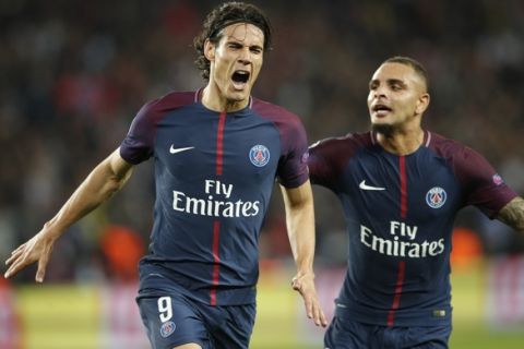 PSG's Edinson Cavani celebrates with PSG's Layvin Kurzawa, right, after scoring his side's second goal during a Champions League Group B soccer match between Paris Saint-Germain and Bayern Munich at the Parc des Princes stadium in Paris, France, Wednesday, Sept. 27, 2017. (AP Photo/Christophe Ena)