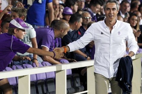 Fiorentina's coach Paulo Sousa greets supporters prior to a Serie A soccer match at the Artemio Franchi stadium in Florence, Italy, Sunday, Aug. 23  2015. (AP Photo/Fabrizio Giovannozzi)