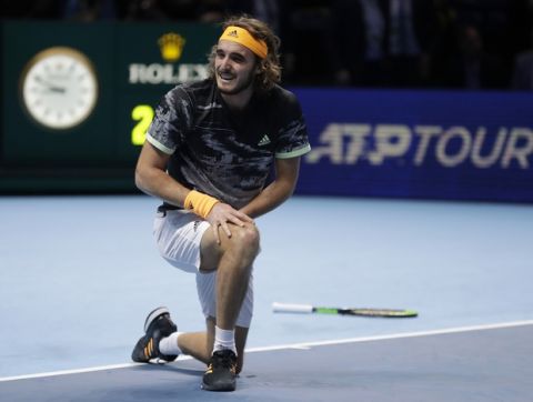Stefanos Tsitsipas of Greece smiles as he celebrates after defeating Austria's Dominic Thiem in their ATP World Finals singles final tennis match at the O2 arena in London, Sunday, Nov. 17, 2019. (AP Photo/Kirsty Wigglesworth)