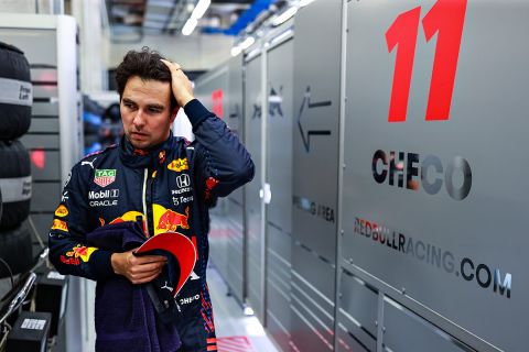 SPIELBERG, AUSTRIA - JULY 03: Sergio Perez of Mexico and Red Bull Racing looks on in the garage during final practice ahead of the F1 Grand Prix of Austria at Red Bull Ring on July 03, 2021 in Spielberg, Austria. (Photo by Mark Thompson/Getty Images)