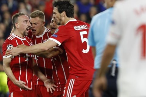 Bayern's Franck Ribery, left, celebrates with team mates after scoring his side's opening goal during the Champions League quarter final first leg soccer match between Sevilla FC and FC Bayern Munich at the Sanchez Pizjuan stadium in Seville, Spain, Tuesday, April 3, 2018. (AP Photo/Miguel Morenatti)
