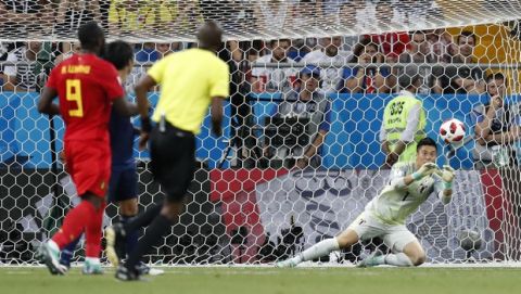 Japan goalkeeper Eiji Kawashima, right, stops a ball during the round of 16 match between Belgium and Japan at the 2018 soccer World Cup in the Rostov Arena, in Rostov-on-Don, Russia, Monday, July 2, 2018. (AP Photo/Rebecca Blackwell)