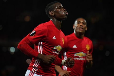 MANCHESTER, ENGLAND - OCTOBER 20:  Paul Pogba of Manchester United celebrates after scoring the opening goal from the penalty spot during the UEFA Europa League Group A match between Manchester United FC and Fenerbahce SK at Old Trafford on October 20, 2016 in Manchester, England.  (Photo by Laurence Griffiths/Getty Images)