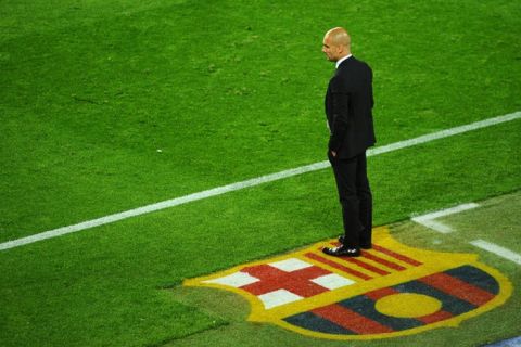 (FILES) A picture taken on  April 24, 2012 shows Barcelona's coach Josep Guardiola watching his team play Chelsea during the UEFA Champions League second leg semi-final football match Barcelona against Chelsea at the Camp Nou stadium in Barcelona. Barcelona coach Pep Guardiola, architect of one the greatest eras in the club's history, reportedly told players on April 27, 2012 he is leaving at the end of this season.      AFP PHOTO / PIERRE-PHILIPPE MARCOUPIERRE-PHILIPPE MARCOU/AFP/GettyImages