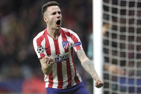 Atletico Madrid's Saul celebrates after scoring his side's first goal during a first leg, round of 16, Champions League soccer match between Atletico Madrid and Liverpool at the Wanda Metropolitano stadium in Madrid, Spain, Tuesday Feb. 18, 2020. (AP Photo/Bernat Armangue)