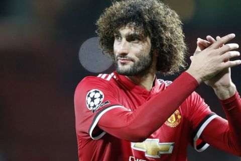 Manchester United's Marouane Fellaini greets the audience at the end of the Champions League group A soccer match between Manchester United and Basel, at the Old Trafford stadium in Manchester, Tuesday, Sept. 12, 2017. (AP Photo/Frank Augstein)