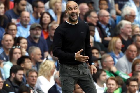 Manchester City's head coach Pep Guardiola reacts during the English Premier League soccer match between Manchester City and Tottenham Hotspur at Etihad stadium in Manchester, England, Saturday, Aug. 17, 2019. (AP Photo/Rui Vieira)