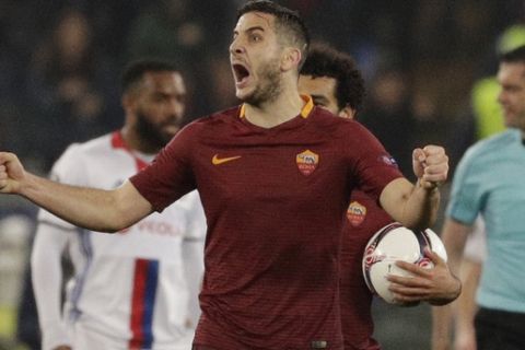 Roma's Kostas Manolas, right, celebrates his sides second goal during the Europa League round of 16 second leg soccer match between Roma and Lyon, in Rome's Olympic stadium, Thursday, March 16, 2017. (AP Photo/Andrew Medichini)