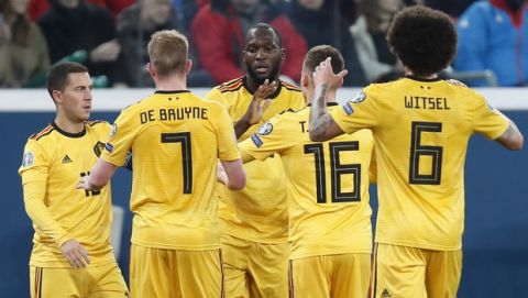 Belgium's Romelu Lukaku, center, celebrates with teammates after scoring his side's fourth goal during the Euro 2020 group I qualifying soccer match between Russia and Belgium, at Gazprom Arena in St. Petersburg, Russia, Saturday, Nov. 16, 2019. (AP Photo/Dmitri Lovetsky)