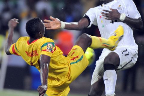 Ghanaian attacker Sulley Muntari (l) and Malian defender Drissa Diakite struggle for possession of the ball during a clash for the quarter-final slot at the 2012 African Cup of Nations played at  Franceville stadium in Gabon on January 28, 2012. AFP PHOTO (Photo credit should read PIUS UTOMI EKPEI/AFP/Getty Images)