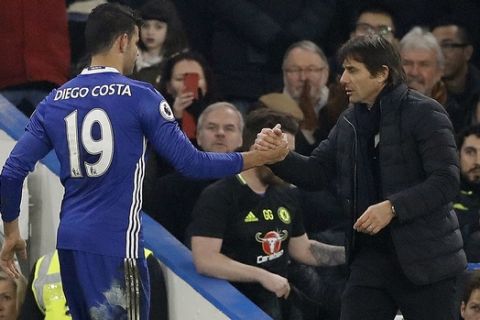 Chelsea's Diego Costa, left, shakes hands with Chelsea's team manager Antonio Conte during the English Premier League soccer match between Chelsea and Hull City at Stamford Bridge stadium in London, Sunday, Jan. 22, 2017. (AP Photo/Frank Augstein)