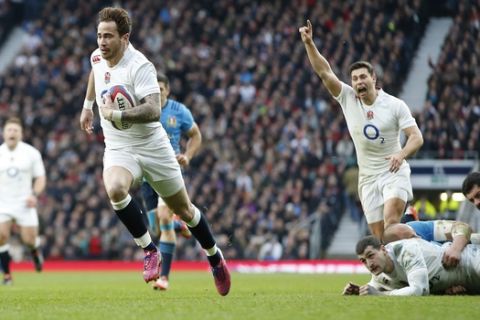 Englands Danny Cipriani races clear to score a try during the Six Nations international rugby union match against Italy at Twickenham stadium in London, Saturday, Feb. 14, 2015. (AP Photo/Alastair Grant)