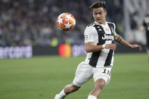 Juventus' Paulo Dybala goes for the ball during the Champions League, quarterfinal, second leg soccer match between Juventus and Ajax, at the Allianz stadium in Turin, Italy, Tuesday, April 16, 2019. (AP Photo/Luca Bruno)