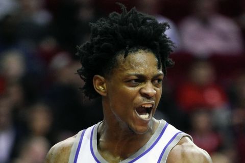 Sacramento Kings guard De'Aaron Fox reacts after drawing a foul after making a basket during the first half of an NBA basketball game against the Houston Rockets, Saturday, Nov. 17, 2018, in Houston. (AP Photo/Eric Christian Smith)