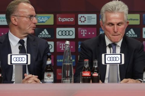 Bayern Munich's new coach Jupp Heynckes, center, is flanked by the club's CEO Karl-Heinz Rummenigge, left, and president Uli Hoeness during his presentation at a news conference in Munich, Germany, Monday, Oct. 9, 2017. Heynckes coached the Bundesliga team already from 1987 to 1991, 2009 and from 2011 to 2013. (AP Photo/Matthias Schrader)