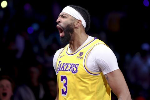 Los Angeles Lakers forward Anthony Davis (3) yells after making a basket against the Indiana Pacers during the second half of the championship game in the NBA basketball In-Season Tournament on Saturday, Dec. 9, 2023, in Las Vegas. (AP Photo/Ian Maule)