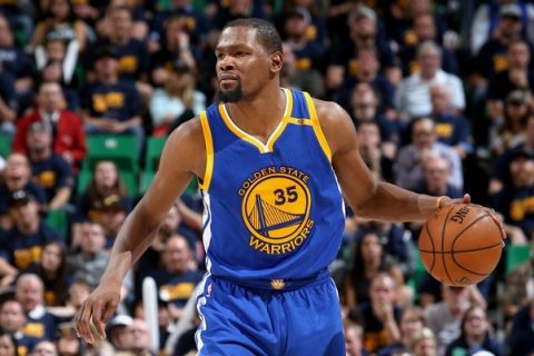 SALT LAKE CITY, UT - MAY 6:  Kevin Durant #35 of the Golden State Warriors handles the ball against the Utah Jazz during Game Three of the Western Conference Semifinals of the 2017 NBA Playoffs on May 6, 2017 at vivint.SmartHome Arena in Salt Lake City, Utah. NOTE TO USER: User expressly acknowledges and agrees that, by downloading and/or using this Photograph, user is consenting to the terms and conditions of the Getty Images License Agreement. Mandatory Copyright Notice: Copyright 2017 NBAE (Photo by Melissa Majchrzak/NBAE via Getty Images)