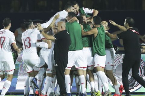Tunisian players celebrate after a goal during the African Cup of Nations quarterfinal soccer match between Madagascar and Tunisia in Al Salam stadium in Cairo, Egypt, Thursday, July 11, 2019. (AP Photo/Hassan Ammar)