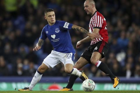 Everton's Muhamed Besic, left, and Sunderland's Darron Gibson in action during their English League Cup soccer match at Goodison Park in Liverpool, England, Wednesday Sept. 20, 2017. (Nick Potts/PA via AP)