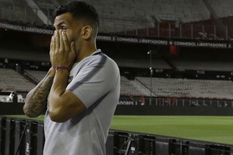 CORRECTS PHOTOGRAPHER"S BYLINE - Carlos Tevez of Argentina's Boca Juniors, waits in the Antonio Vespucio Liberti stadium after the Copa Libertadores championship match was rescheduled, in Buenos Aires, Argentina, Saturday, Nov. 24, 2018. The Saturday match was rescheduled for Sunday after the bus carrying the Boca Juniors players was attacked by River Plate fans, injuring several players including Perez. (AP Photo/Natacha Pisarenko)