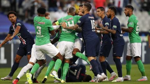 Players scrum after PSG's Kylian Mbappe, center down, was tackled during the French Cup soccer final match between Paris Saint Germain and Saint Etienne at Stade de France stadium, in Saint Denis, north of Paris, Friday July 24, 2020. (AP Photo/Francois Mori)