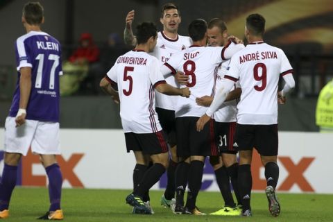 AC Milan's Suso (8) celebrates with team mates after scoring his side's fifth goal during the Europa League group D first leg soccer match between Austria Vienna and AC Milan at the Ernst Happel Stadium in Vienna, Austria, Thursday, Sept. 14, 2017. (AP Photo/Ronald Zak)